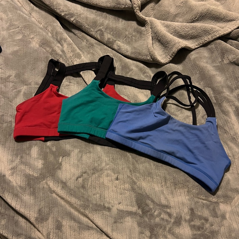 Red, blue & green Born Primitive sport bras.